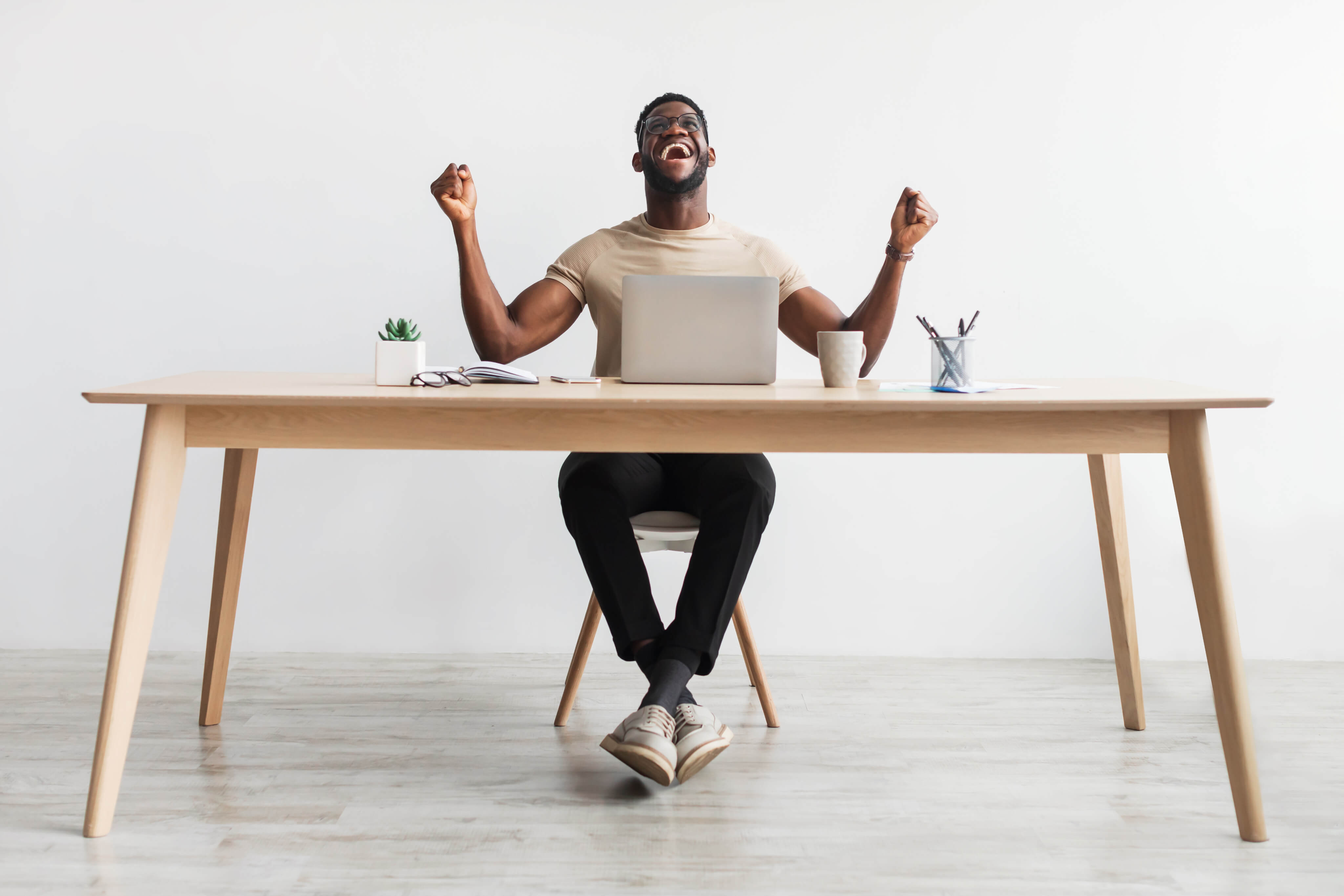 Happy man behind the desk